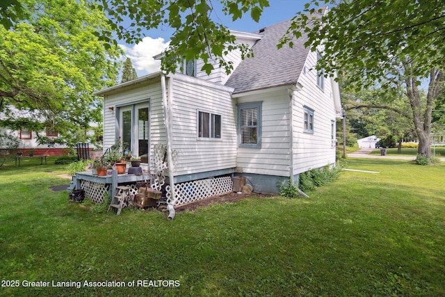 1213 N Woodworth Rd, Jackson, MI 49202 - view of home's exterior featuring a shingled roof