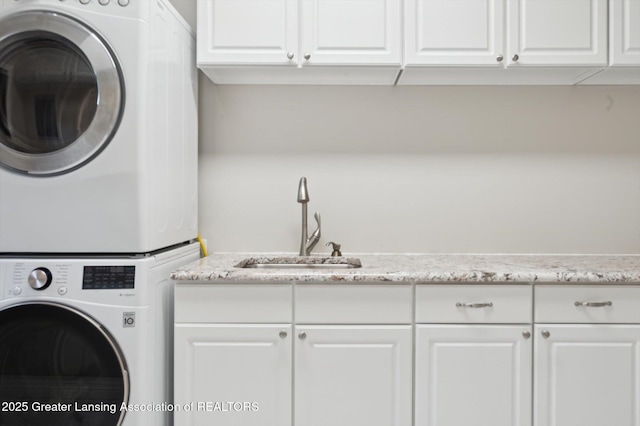 4700 Canyon Trl, Lansing, MI 48917 - laundry area with cabinet space and estacked washer and dryer