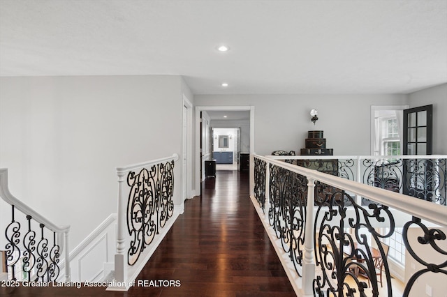 4700 Canyon Trl, Lansing, MI 48917 - hallway with recessed lighting, wood finished floors, and an upstairs landing