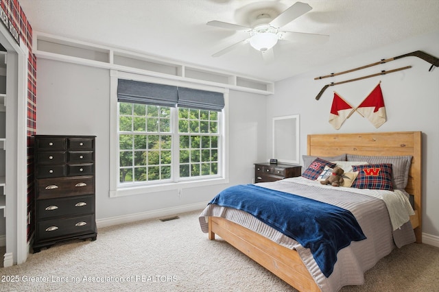4700 Canyon Trl, Lansing, MI 48917 - bedroom with carpet floors and ceiling fan