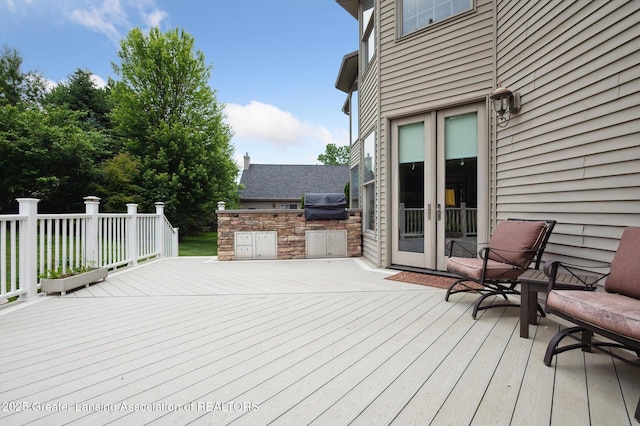 4700 Canyon Trl, Lansing, MI 48917 - wooden deck featuring grilling area and french doors