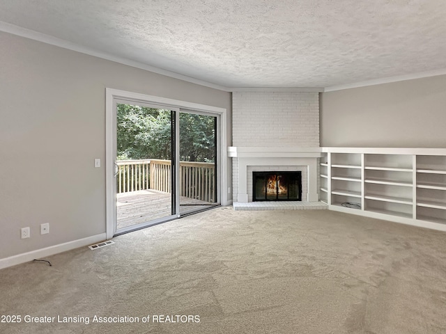 1869 E Burrwood Cir, East Lansing, MI 48823 - unfurnished living room featuring carpet, a fireplace, a textured ceiling, and crown molding