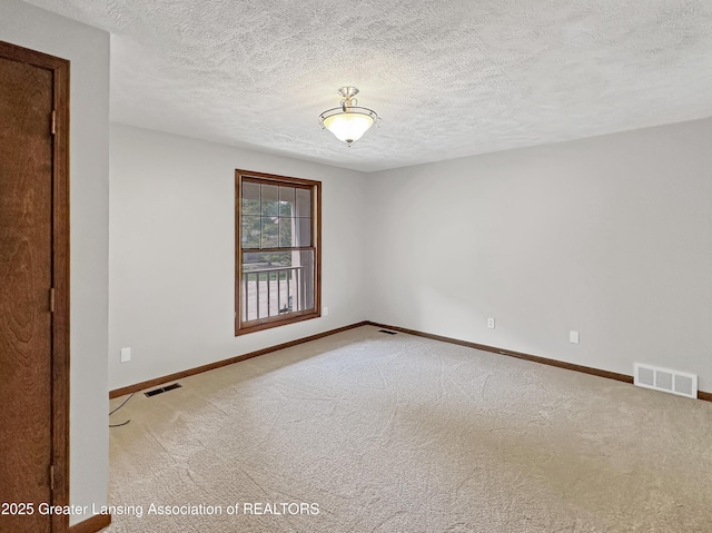 1869 E Burrwood Cir, East Lansing, MI 48823 - empty room with carpet flooring and a textured ceiling