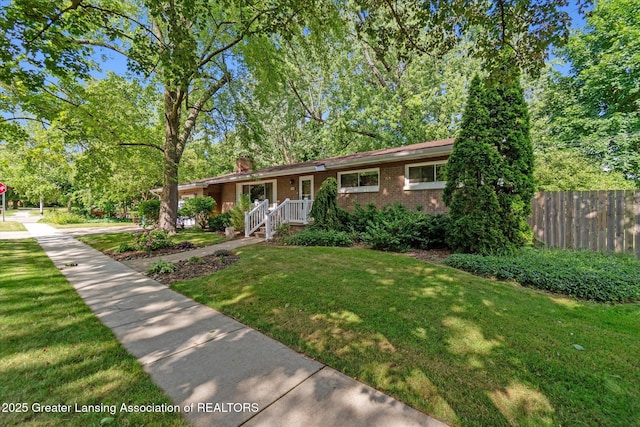 522 Cowley Ave, East Lansing, MI 48823 - view of front facade with brick siding and a chimney