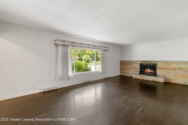 522 Cowley Ave, East Lansing, MI 48823 - unfurnished living room with wood finished floors and a fireplace