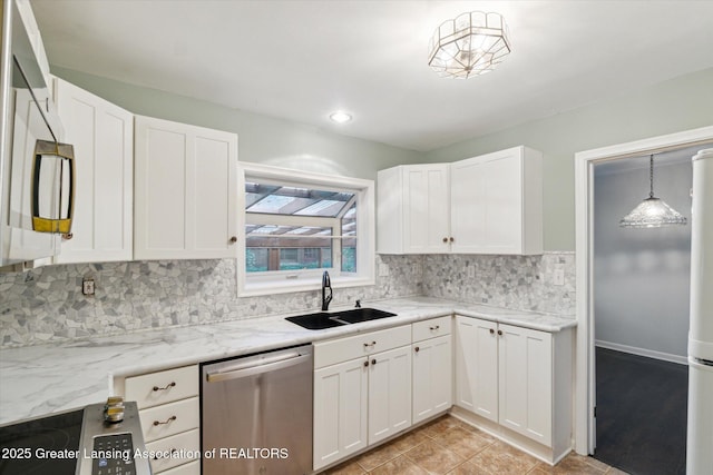 522 Cowley Ave, East Lansing, MI 48823 - kitchen featuring stainless steel dishwasher, white cabinetry, tasteful backsplash, and light stone countertops