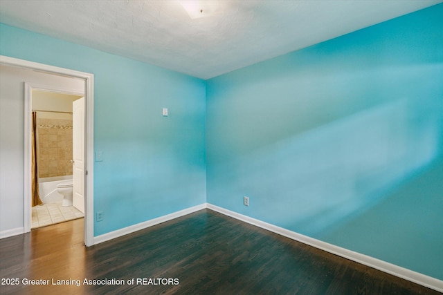 522 Cowley Ave, East Lansing, MI 48823 - unfurnished room with baseboards and wood finished floors