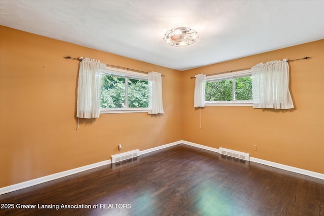 522 Cowley Ave, East Lansing, MI 48823 - empty room featuring baseboards and wood finished floors