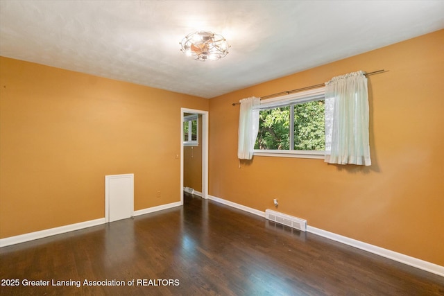 522 Cowley Ave, East Lansing, MI 48823 - spare room with baseboards and wood finished floors