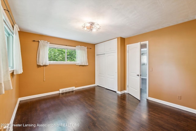 522 Cowley Ave, East Lansing, MI 48823 - unfurnished bedroom featuring wood finished floors and a closet