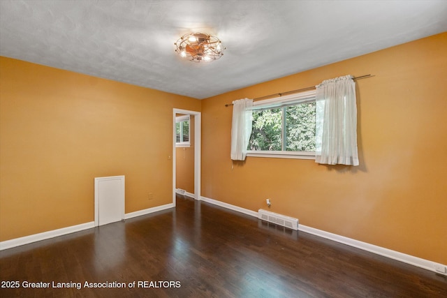 522 Cowley Ave, East Lansing, MI 48823 - spare room featuring baseboards and wood finished floors