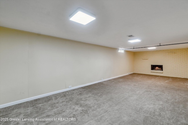 522 Cowley Ave, East Lansing, MI 48823 - finished basement with carpet flooring, a brick fireplace, and brick wall
