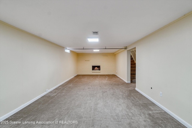 522 Cowley Ave, East Lansing, MI 48823 - finished basement with carpet flooring, a warm lit fireplace, and stairway