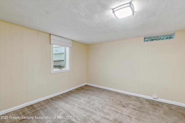 522 Cowley Ave, East Lansing, MI 48823 - empty room with a textured ceiling and carpet flooring