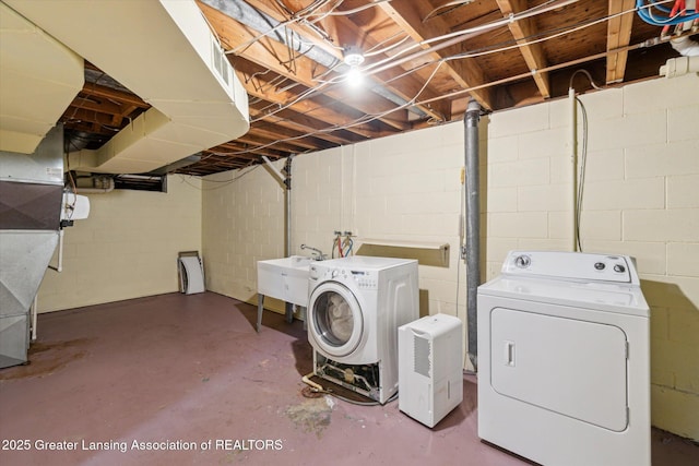 522 Cowley Ave, East Lansing, MI 48823 - laundry area with separate washer and dryer and concrete block wall