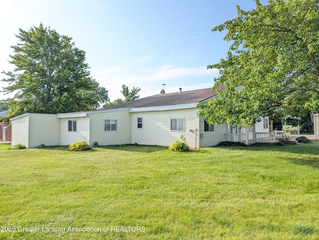 4963 E Portland Rd, Portland, MI 48875 - back of property featuring a lawn