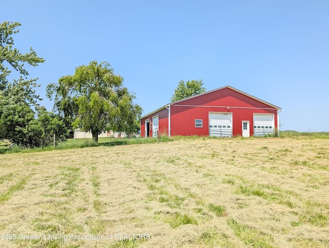 4963 E Portland Rd, Portland, MI 48875 - view of yard with an outbuilding, an outdoor structure, and a garage