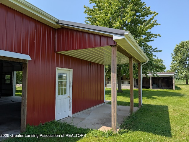 4963 E Portland Rd, Portland, MI 48875 - view of home's exterior featuring a lawn and an outdoor structure
