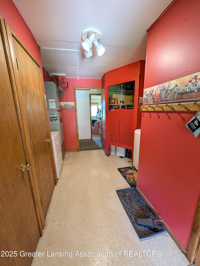 4963 E Portland Rd, Portland, MI 48875 - hallway with light floors, washer / clothes dryer, and water heater