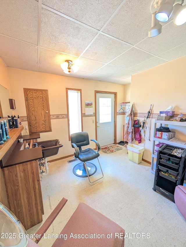 4963 E Portland Rd, Portland, MI 48875 - living room featuring a paneled ceiling and tile patterned floors