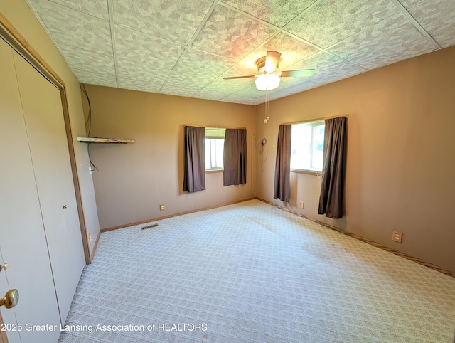 4963 E Portland Rd, Portland, MI 48875 - unfurnished bedroom featuring carpet flooring, a closet, and a ceiling fan