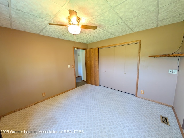 4963 E Portland Rd, Portland, MI 48875 - unfurnished bedroom with a closet, carpet floors, and a ceiling fan