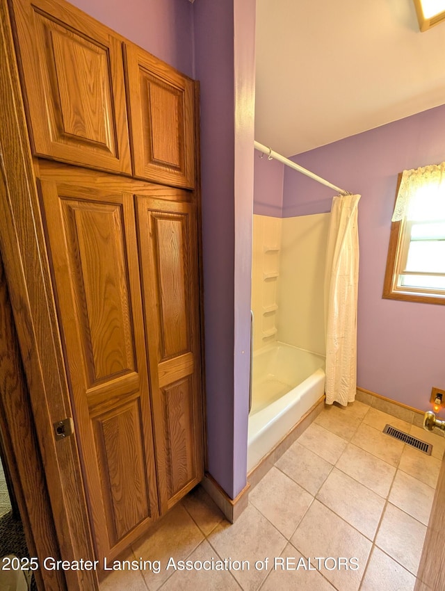 4963 E Portland Rd, Portland, MI 48875 - full bathroom featuring tile patterned floors and shower / tub combo with curtain