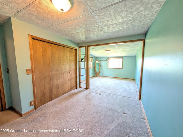 4963 E Portland Rd, Portland, MI 48875 - unfurnished bedroom featuring carpet floors and a closet