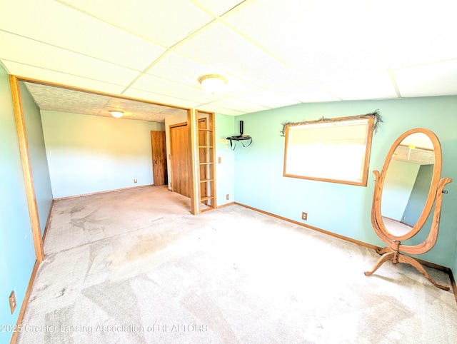 4963 E Portland Rd, Portland, MI 48875 - carpeted spare room featuring a paneled ceiling and baseboards