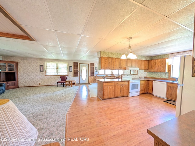 4963 E Portland Rd, Portland, MI 48875 - kitchen featuring white appliances, wallpapered walls, open floor plan, a paneled ceiling, and under cabinet range hood