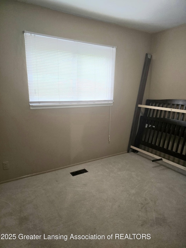 3701 Sumpter St, Lansing, MI 48911 - carpeted empty room featuring baseboards