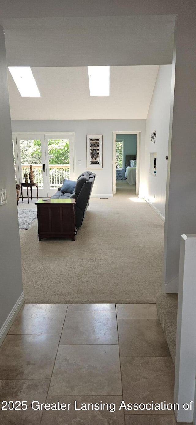 1945 W Danbury, Okemos, MI 48864 - living area with carpet flooring and a skylight