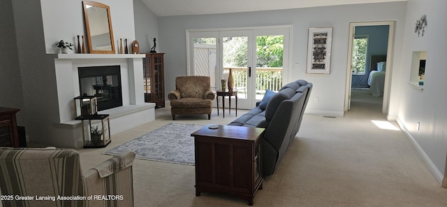 1945 W Danbury, Okemos, MI 48864 - living area with light carpet and a glass covered fireplace