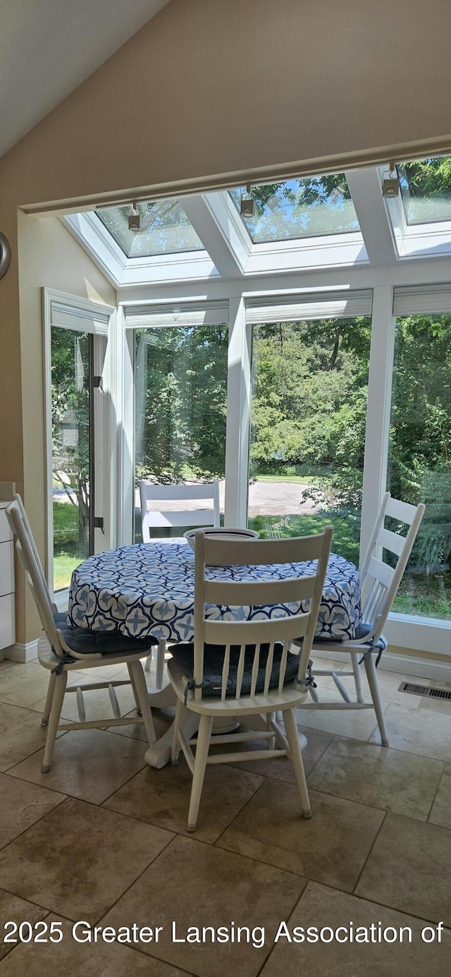 1945 W Danbury, Okemos, MI 48864 - sunroom featuring a skylight and lofted ceiling