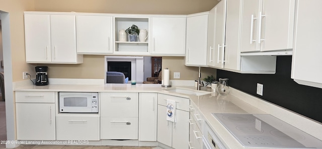 1945 W Danbury, Okemos, MI 48864 - kitchen featuring white appliances, white cabinetry, open shelves, light countertops, and exhaust hood