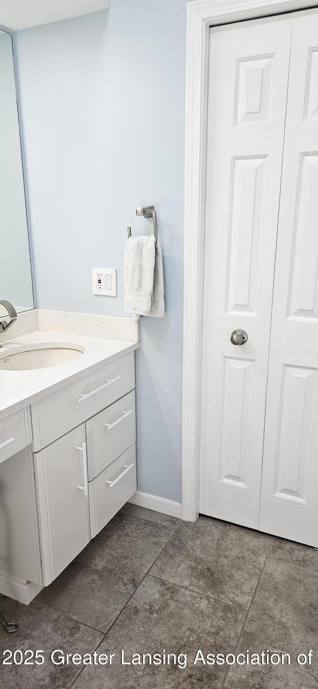 1945 W Danbury, Okemos, MI 48864 - bathroom with vanity and tile patterned floors