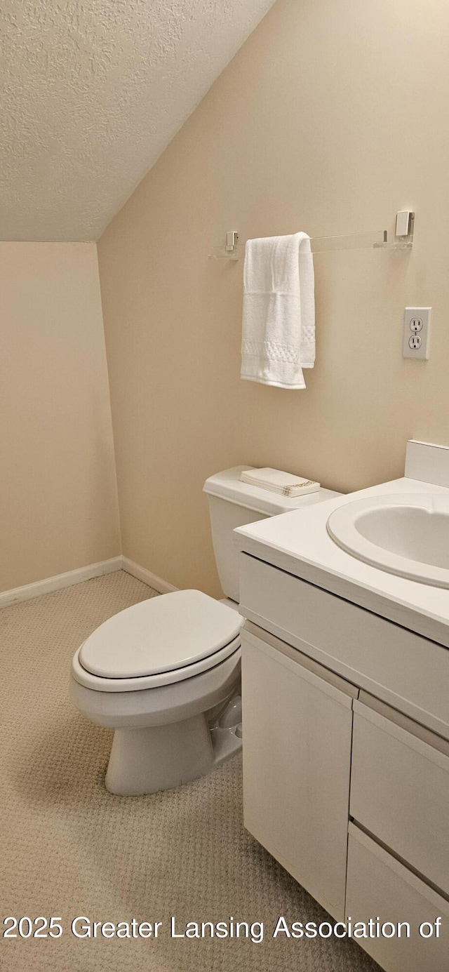 1945 W Danbury, Okemos, MI 48864 - half bathroom with vanity and a textured ceiling