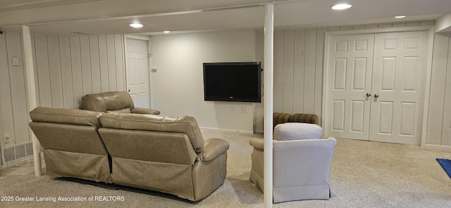 1945 W Danbury, Okemos, MI 48864 - living room with carpet, recessed lighting, and wooden walls
