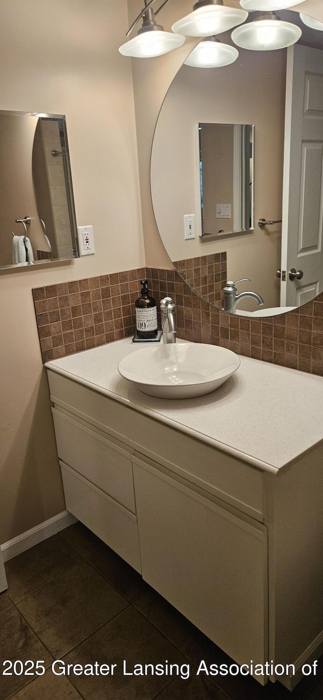 1945 W Danbury, Okemos, MI 48864 - bathroom featuring tile patterned floors, vanity, and backsplash
