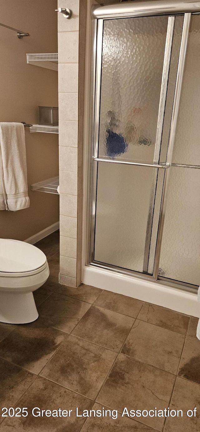 1945 W Danbury, Okemos, MI 48864 - bathroom featuring a shower stall and tile patterned floors