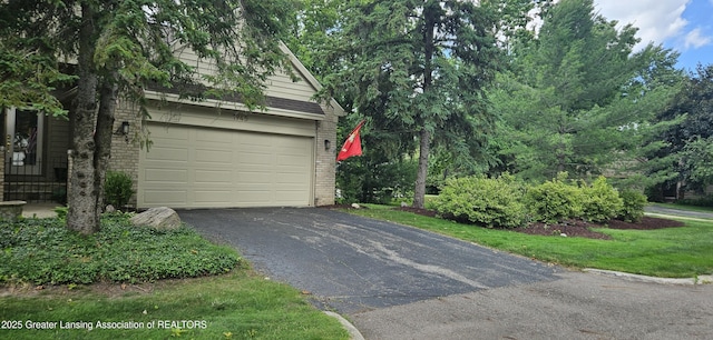 1945 W Danbury, Okemos, MI 48864 - garage featuring driveway