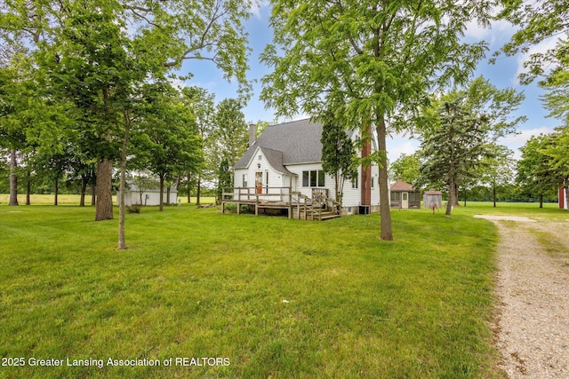 16544 S Chapin Rd, Elsie, MI 48831 - view of front of house with a deck and a front yard