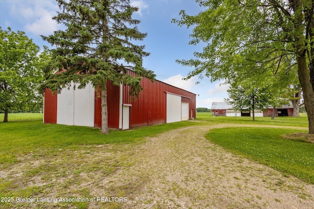 16544 S Chapin Rd, Elsie, MI 48831 - view of pole building featuring a lawn and driveway