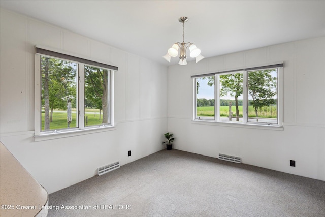 16544 S Chapin Rd, Elsie, MI 48831 - empty room with plenty of natural light, a chandelier, and light colored carpet