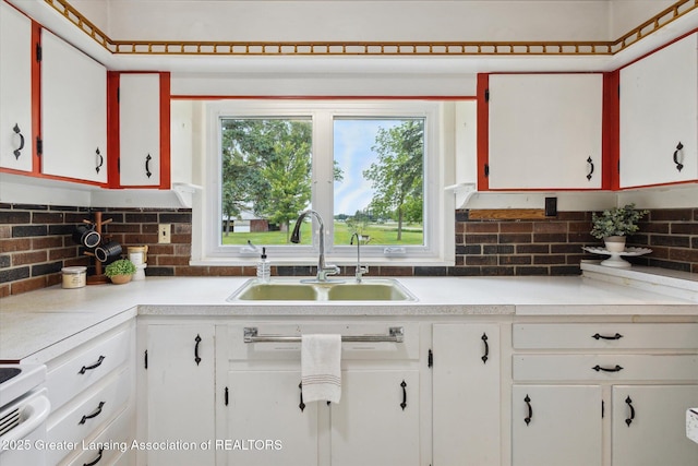 16544 S Chapin Rd, Elsie, MI 48831 - kitchen with light countertops, tasteful backsplash, and white cabinetry