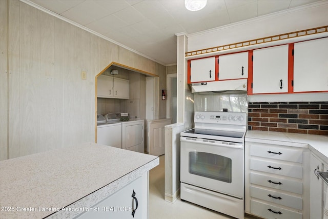 16544 S Chapin Rd, Elsie, MI 48831 - kitchen featuring electric stove, under cabinet range hood, independent washer and dryer, crown molding, and light countertops