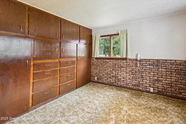 16544 S Chapin Rd, Elsie, MI 48831 - unfurnished bedroom featuring carpet and brick wall