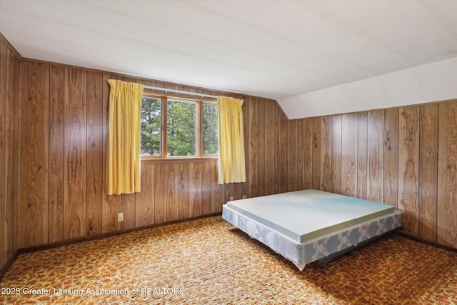 16544 S Chapin Rd, Elsie, MI 48831 - bedroom featuring wooden walls and lofted ceiling