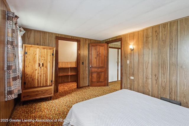 16544 S Chapin Rd, Elsie, MI 48831 - bedroom with wood walls and carpet floors