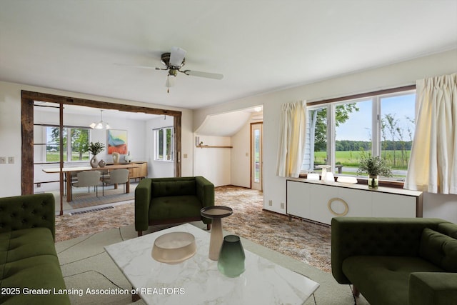 16544 S Chapin Rd, Elsie, MI 48831 - carpeted living room featuring plenty of natural light, ceiling fan, and a chandelier